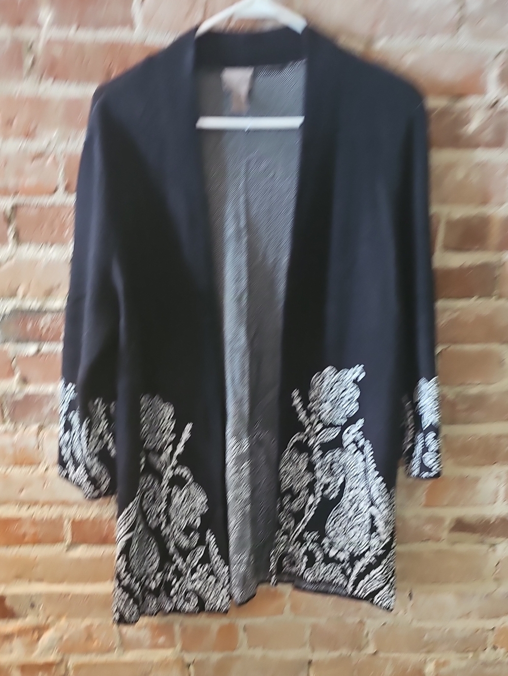 Black Cardigan Sweater with White Floral Hem Trim